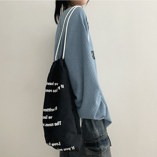 hijjoo(ハイチュー)の「lettering check string bag(Bags)」