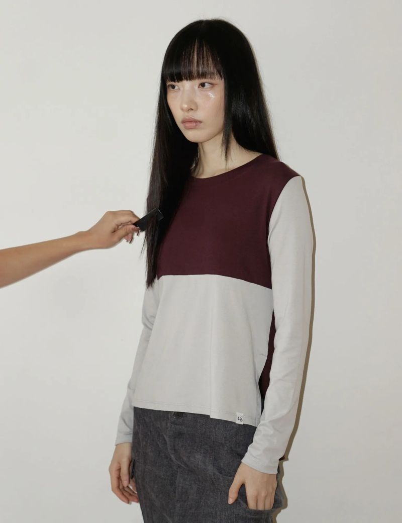 UGLYSHADOW（アグリーシャドウ）の「バック リボン ティーシャツ(GREY BURGUNDY)（トップス）」