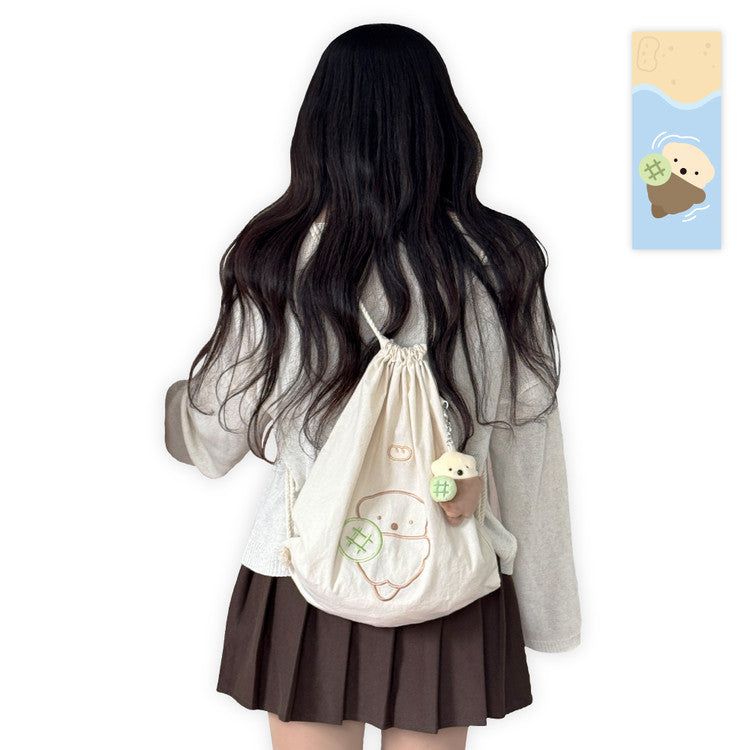 HOOKKA HOOKKA STUDIO（フカフカスタジオ）の「String Backpack - Otter with Melonpan（Bags）」