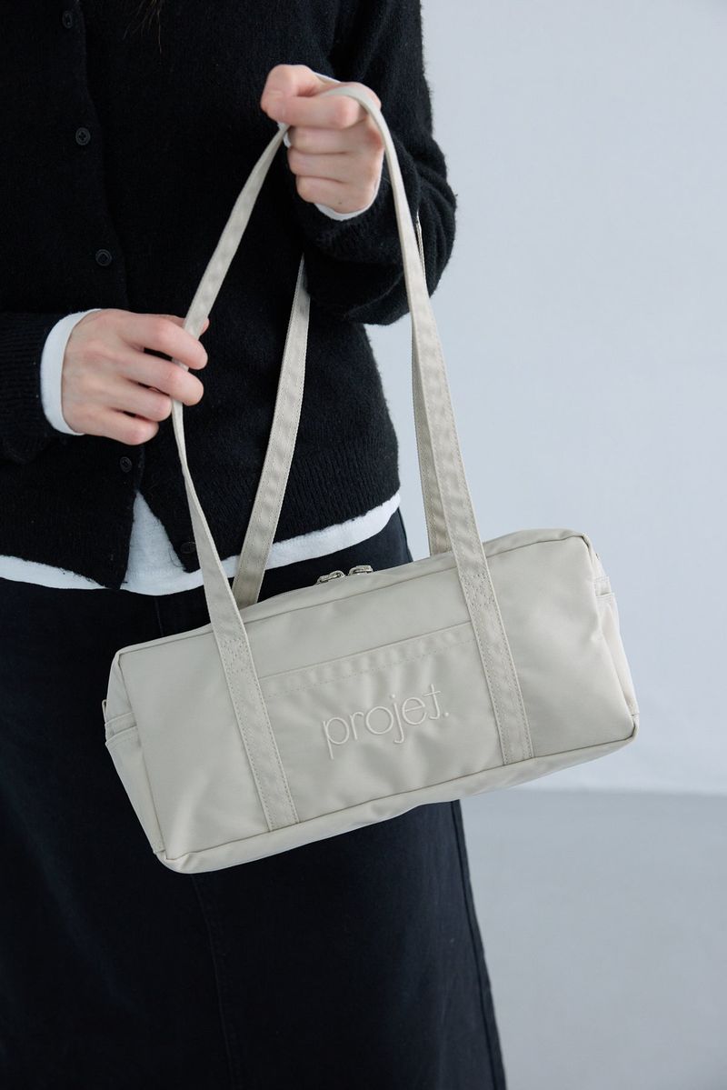 compact duffle bag (light beige)