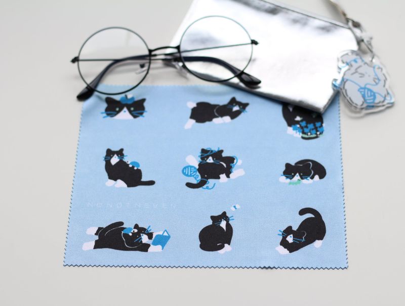 glasses cleaner a tuxedo cat