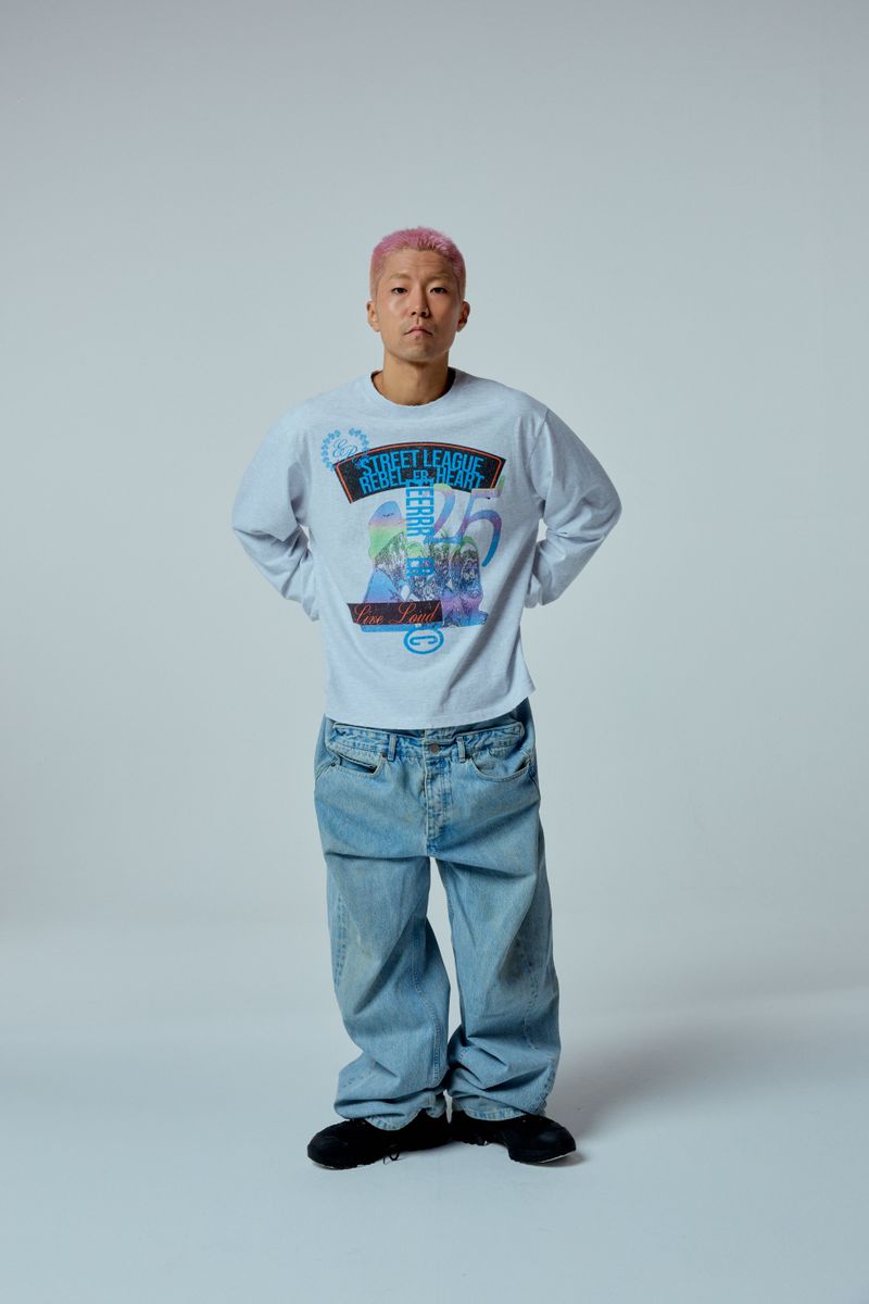 ER(EEERRR)（イーアール）の「ストリートリーグアートワークダメージウォッシュオーバークロップフィットロングスリーブ (メランジ)（トップス）」