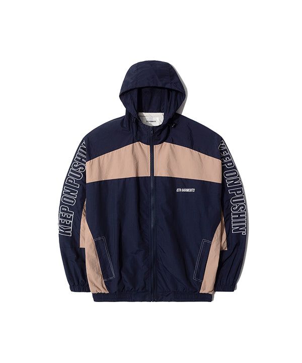 QT8 GARMENTS（キューティーエイトガーメント）の「RG レトロフードトラックジャケット (ネイビー/ベージュ)（ジャケット/アウター）」