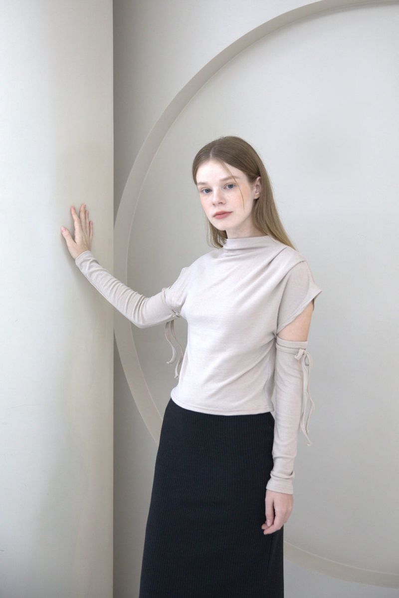 cattline(カトリーヌ)の「Half Neck Cut-out T-shirt Beige(Tops)」
