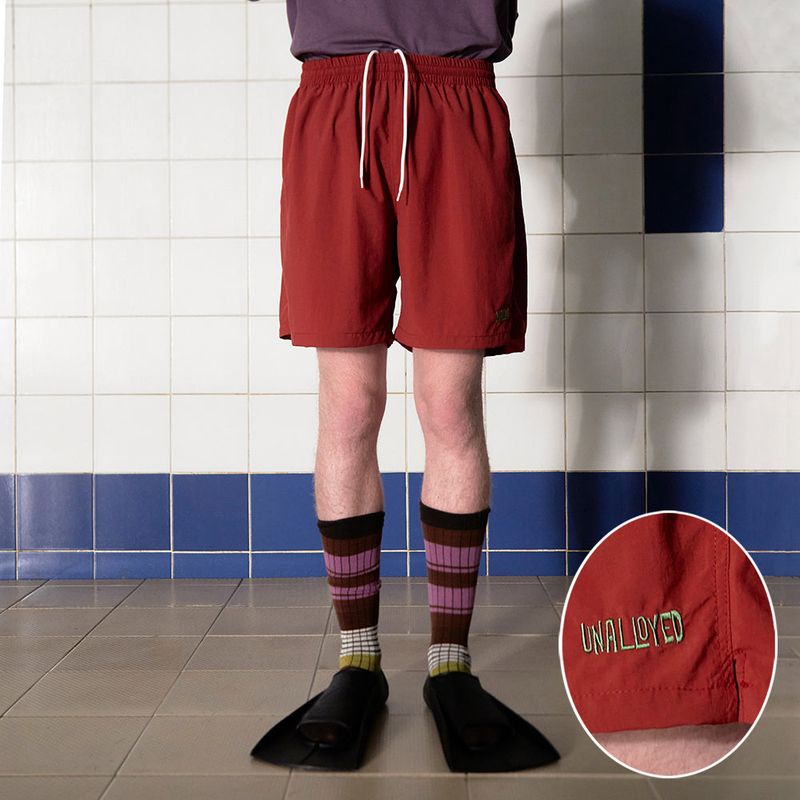 UNALLOYED(アナロイド)の「LOGO NYLON SHORT / BRICK(Pants)」