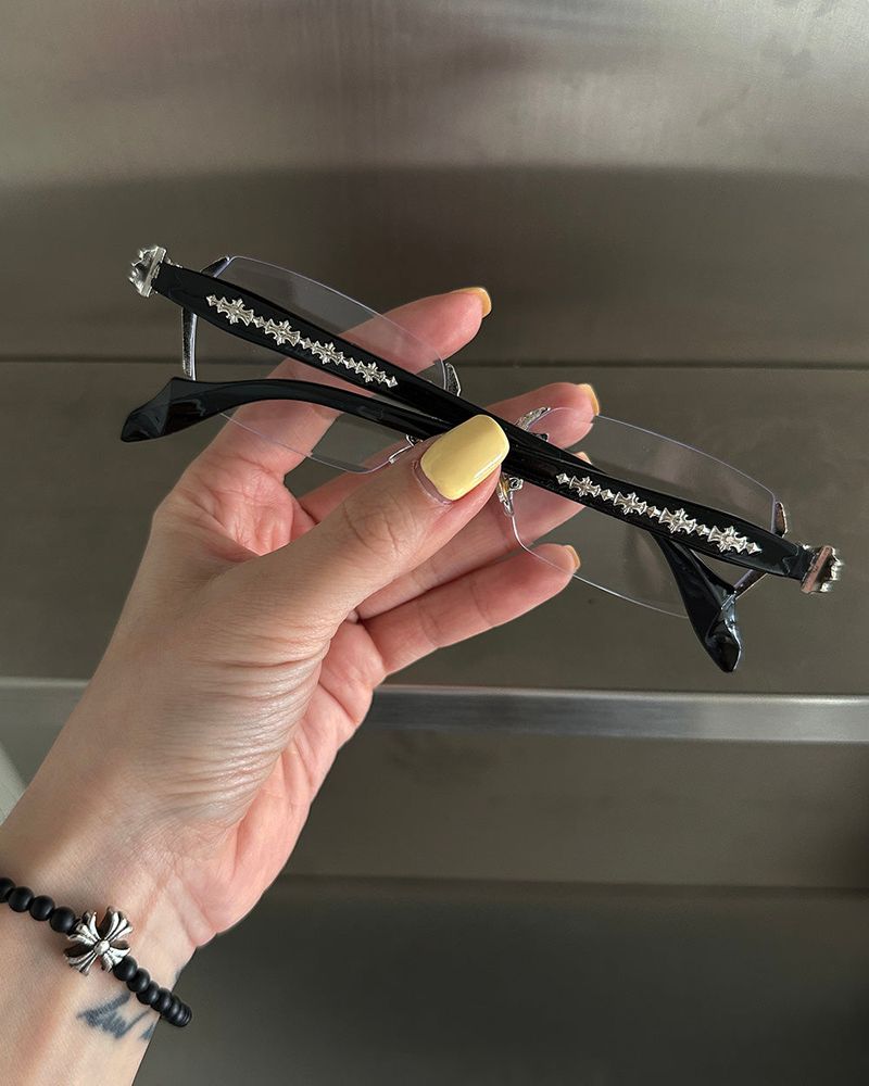 chrome cross-rimmed glasses