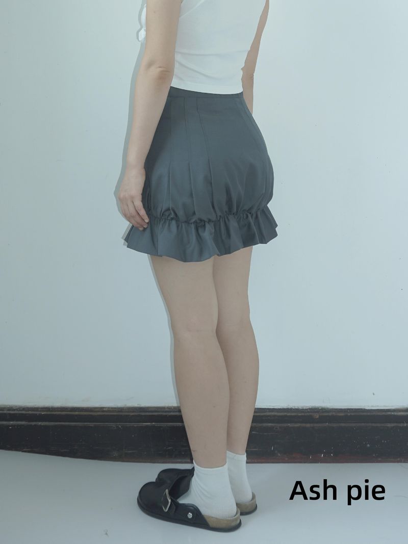 Smocked mini skirt with adjustable buckle