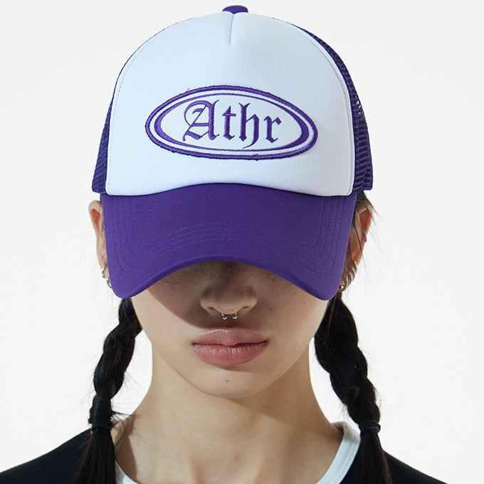 ANDTHEOTHER(アンドジアザー)の「PURPLE ATHR TRUCKER CAP(Hats)」