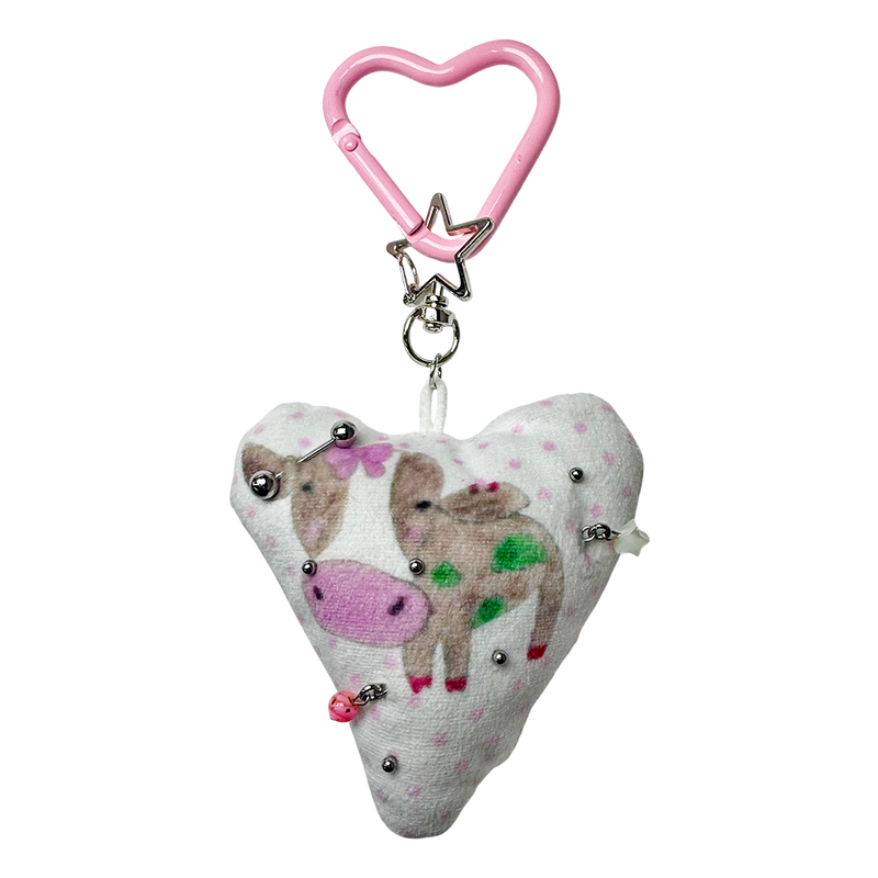 Pierced pinky cow keychain