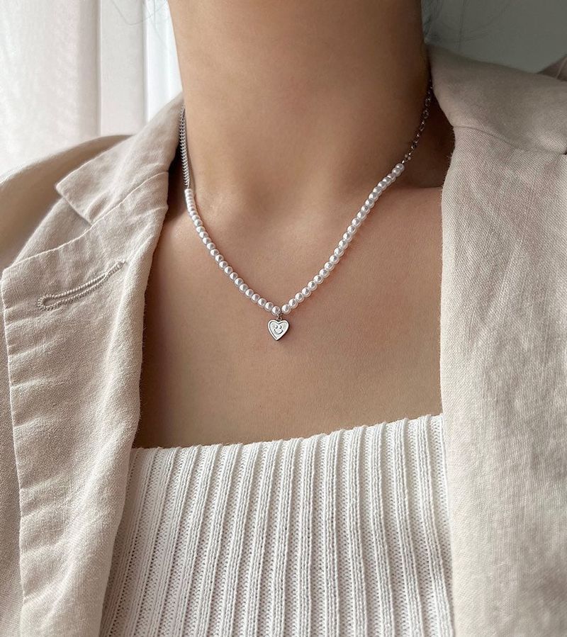 Acer rojo(アセルロジョ)の「juro Surgical Steel Pearl Heart Smile Kitch Layered Short Necklace(Accessories)」