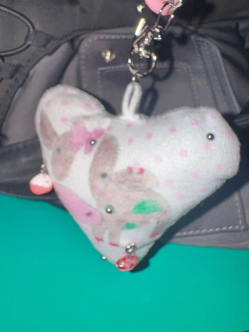 Pierced pinky cow keychain