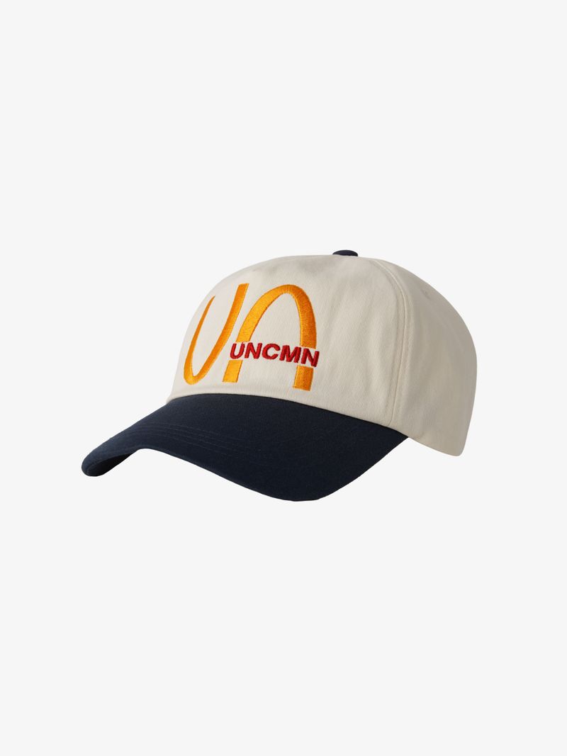 UNCMN（アンカモン）の「I'M LOVIN IT 5-PANEL CAP CREAM & NAVY（Hats）」