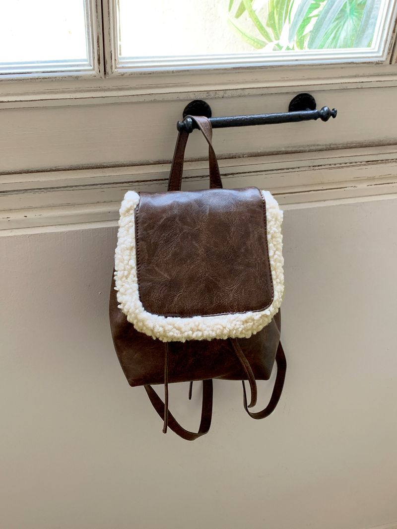 WONDER WONDER(ワンダーワンダー)の「Omtz Vintage Fleece Mustang Leather Mini Backpack(Bags)」