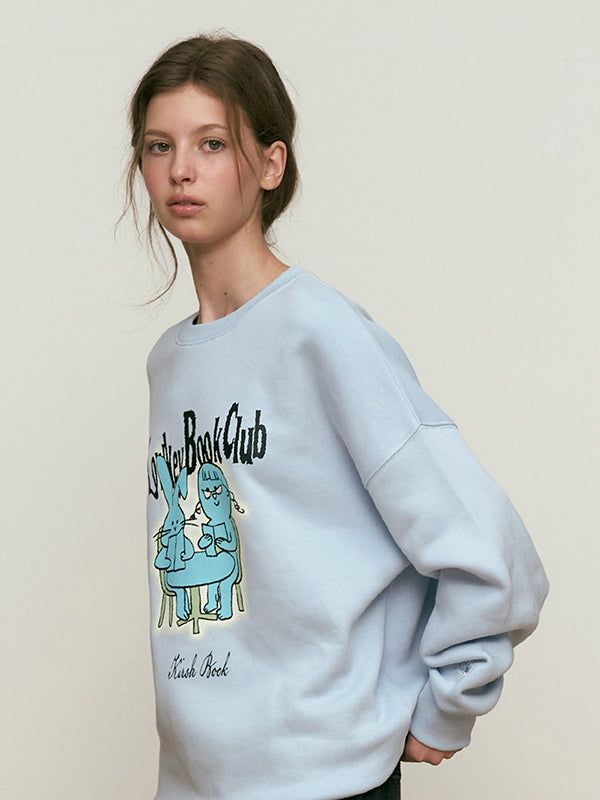 KIRSH（キルシー）の「LOWKEY BOOK CLUB GRAPHIC SWEATSHIRT [SKY]（Tops）」