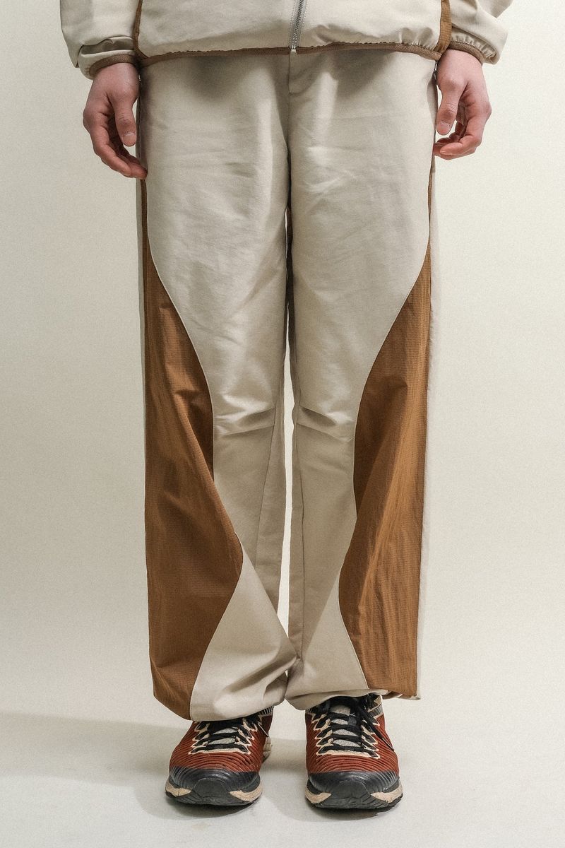 towtow.archive（トゥトゥ アーカイブ）の「ASYMMETRIC WAVE PANTS-BROWN ECRU（Pants）」