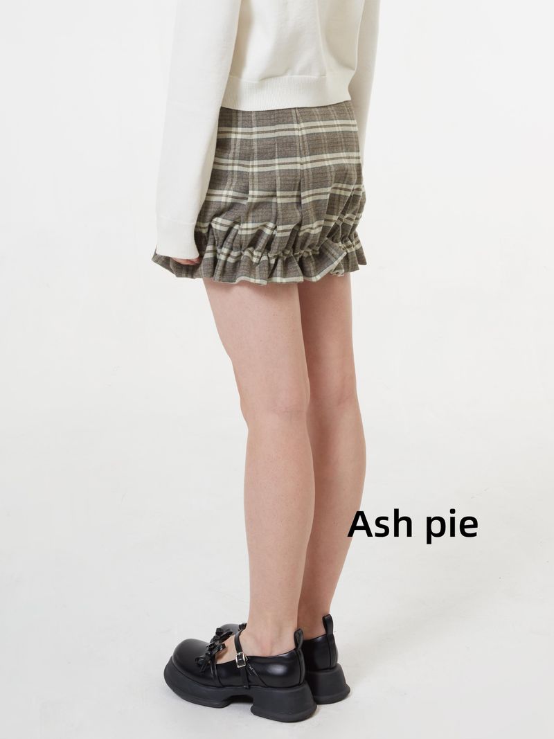 Smocked mini skirt with adjustable buckle