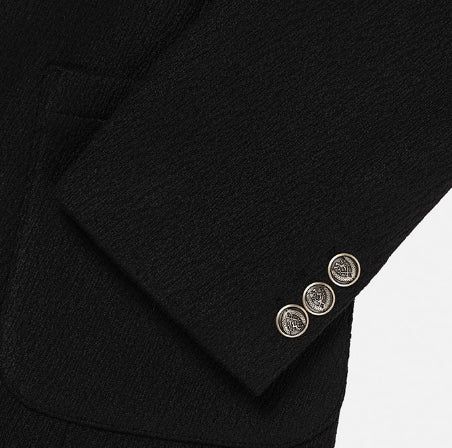Crying medal over blazer