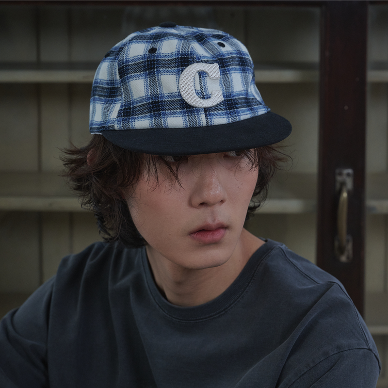 ALLINCOMPLETE(オールインコンプリート)の「Cロゴ チェック キャップ (Blue Check)(帽子)」
