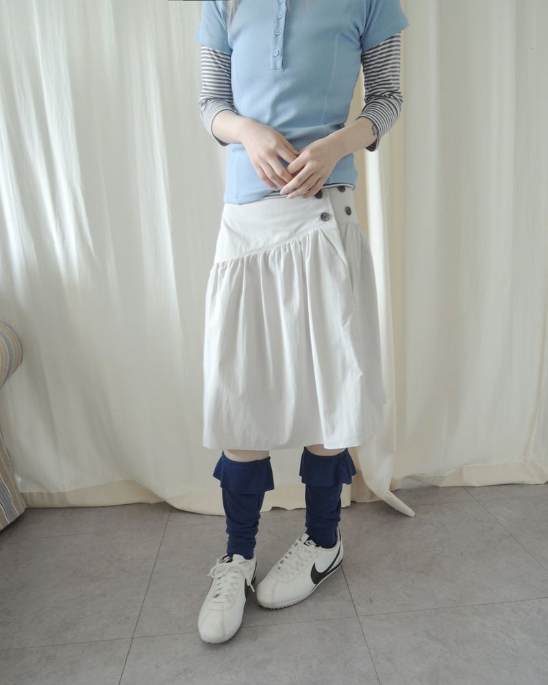 SLOW BUTTON FLARE MIDI SKIRT