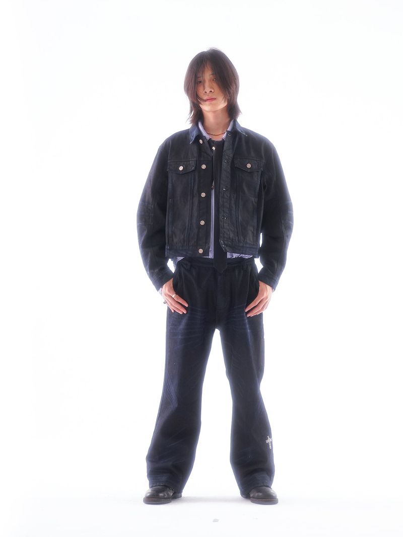 COATED KNIFE-SCRAPED HAND-WIPED DISTRESSED BOOTCUT JEANS