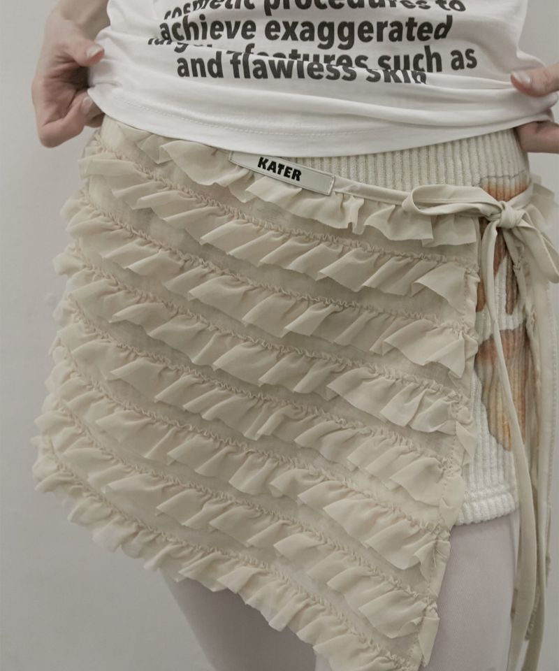 KATER（カーター）の「Frilled Mini Wrap Skirt Beige（Skirts）」