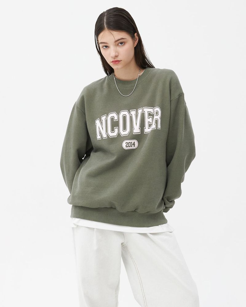 NCOVER(エンカバー)の「PIGMENT CRACK LOGO SWEATSHIRT-KHAKI(Tops)」