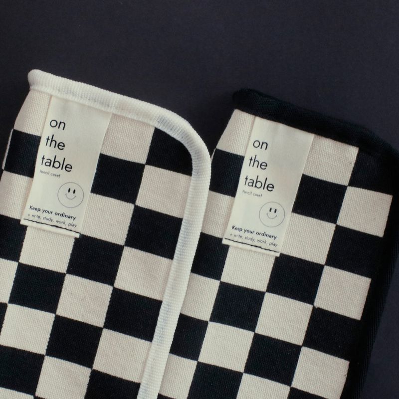 On the table pen case (checkerboard)
