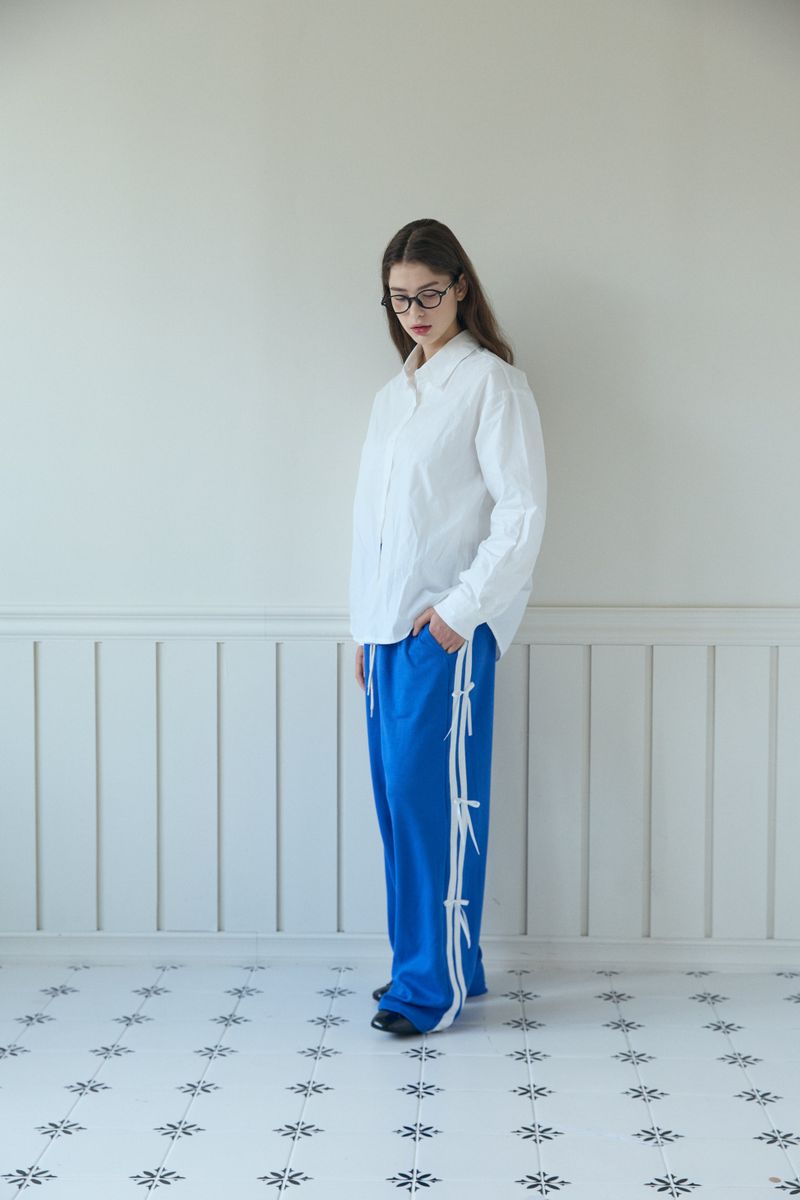 PINK PINEAPPLE(ピンクパイナップル)の「RIBBON TRACK PANTS (2 COLORS)(Pants)」