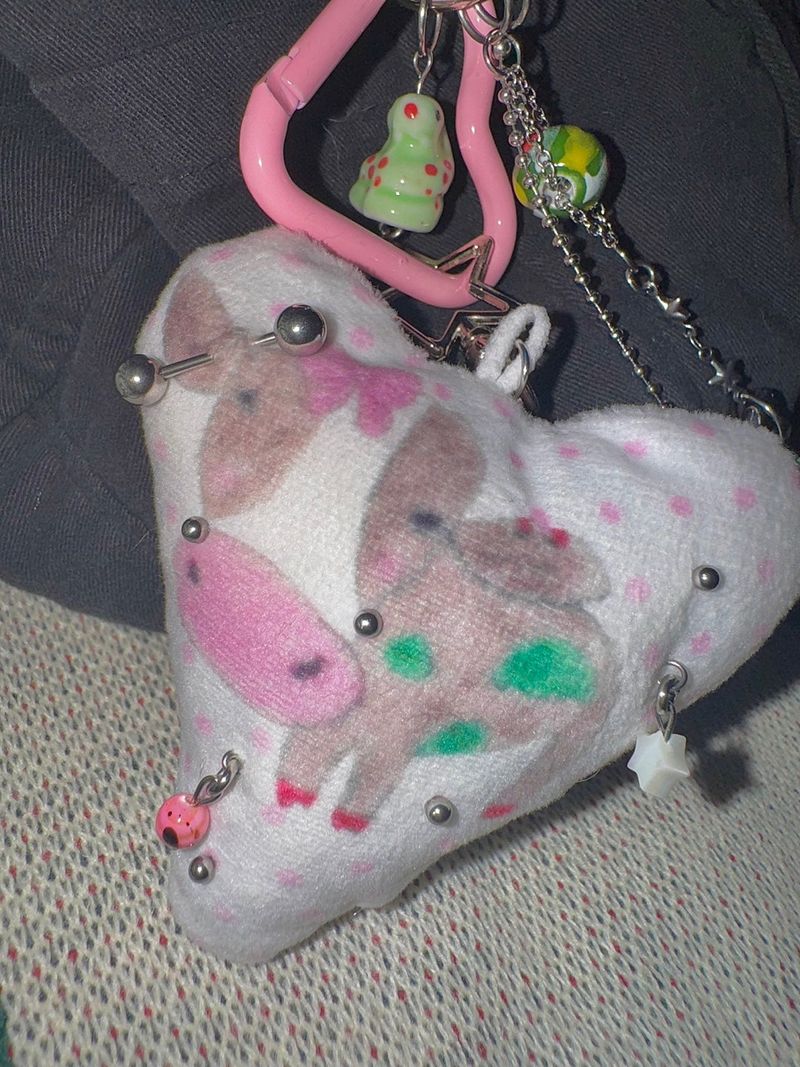 Pierced pinky cow keychain