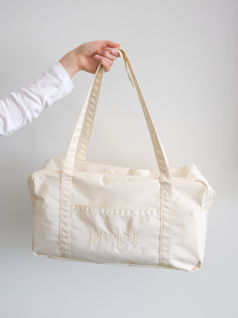 projet（プロジェ）の「standard duffle bag (cream yellow)（Bags）」