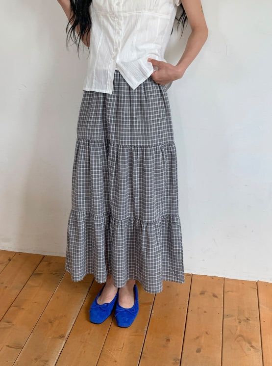 BAON（バオン）の「Hinari Check Tiered Banding Long Skirt（Skirts）」