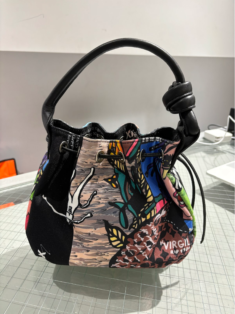 WooLeeX(ウーリーエックス)の「Comics Printed x Leather Bucket Bag with Drawstring(Bags)」