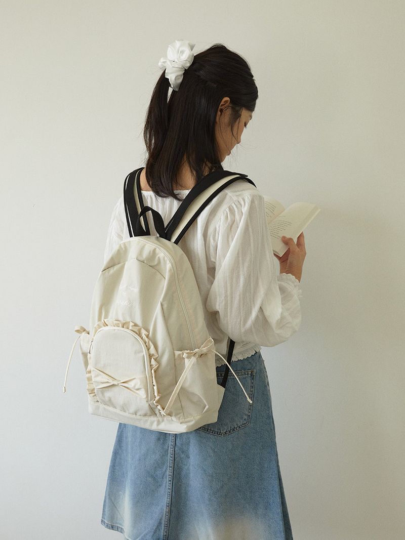 ovuni（オーブニ）の「Ruffle ribbon backpack_ivory（Bags）」