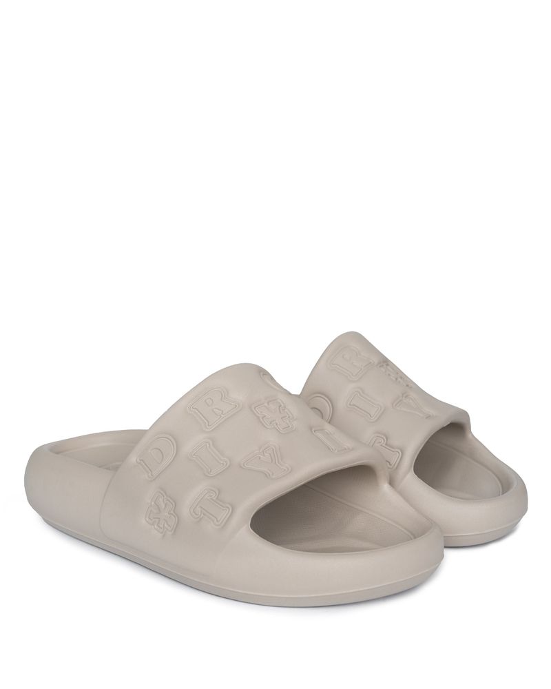 DirtyCoins（ダーティーコインズ）の「DirtyCoins Embossed Slides - Sand（Shoes）」