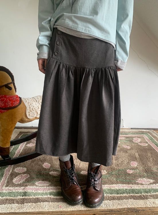 BAON（バオン）の「Lucier Button Pintuck Flare Midi Skirt（Skirts）」