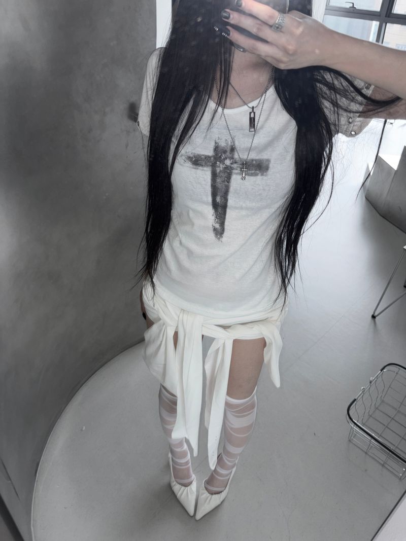 URBAN UNIQUE(アーバンユニーク)の「punching vintage cross T(Tops)」