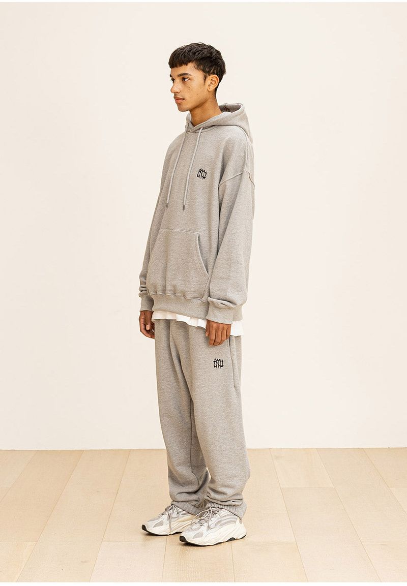 GRATING EMBLEM BACK SLIT ZIP PANTS