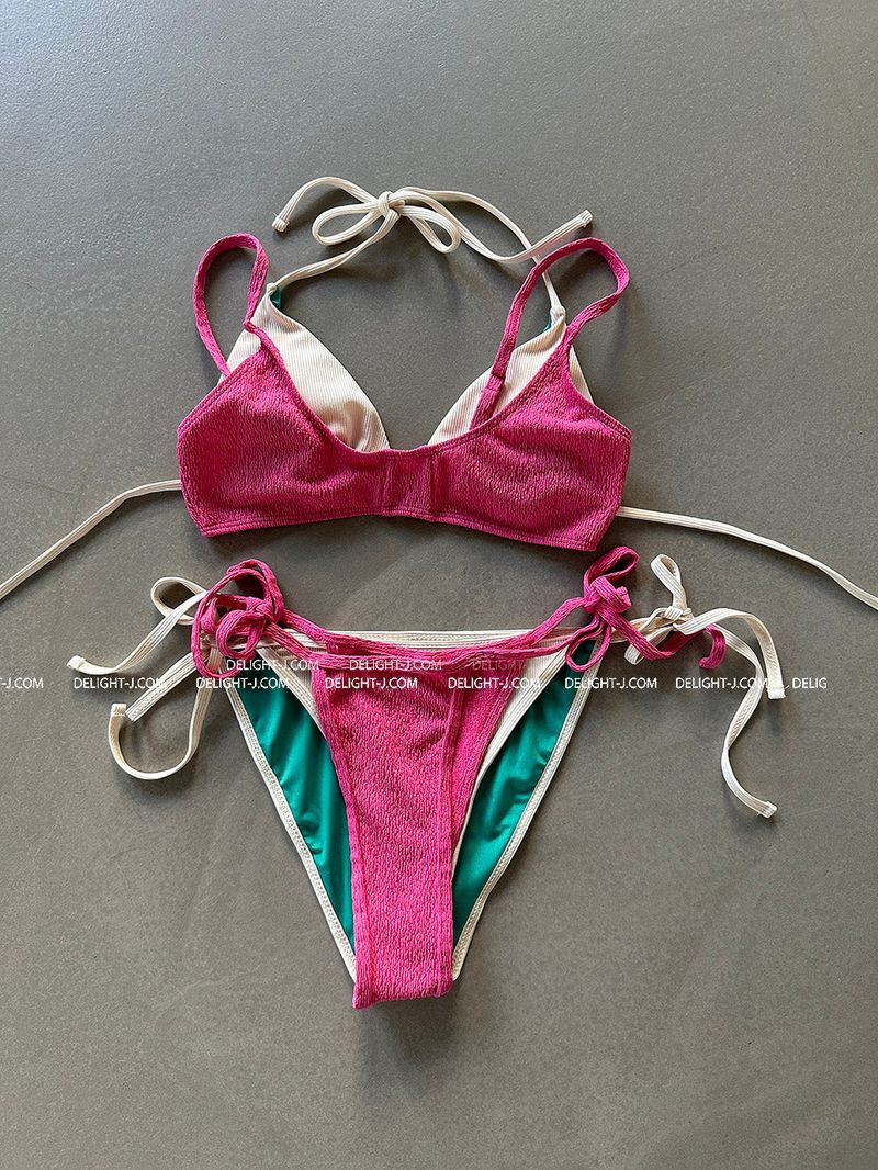 a set of 2 layered colored bikinis