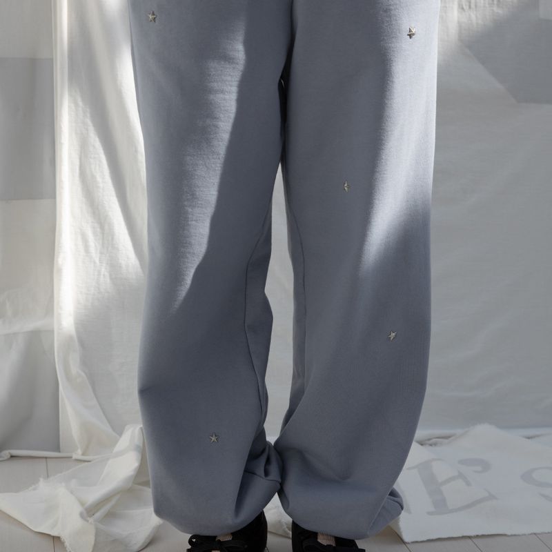 DIMANCHE（ディマンシュ）の「STAR RIVET SWEATPANTS (SKY)（Pants）」
