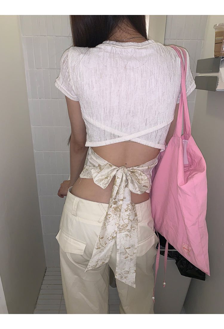 dereborujo（ドレボルゾー）の「Back scarf bow see-through short sleeve T-shirt（Tops）」