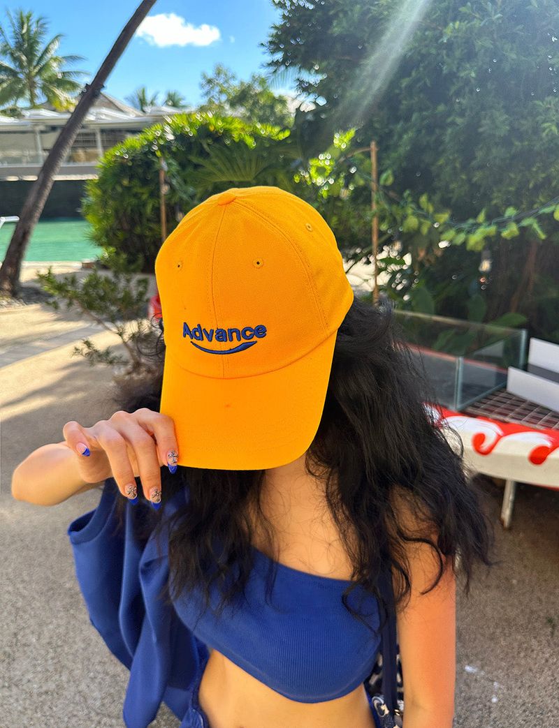 Yellow lettering ball cap