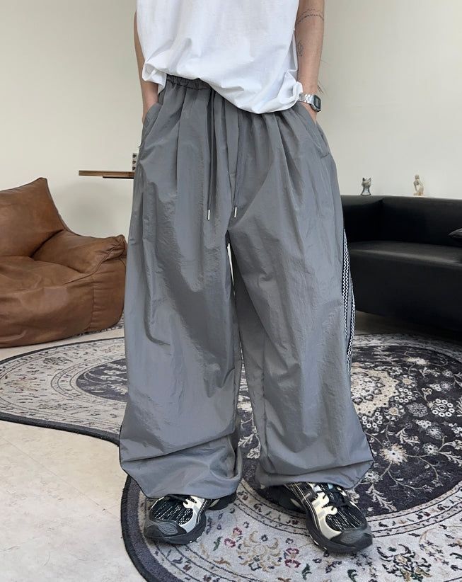 SATIIIZ（サティーズ）の「Hera Curve Track Nylon Pants（Pants）」