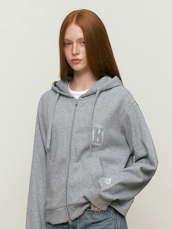 KIRSH（キルシー）の「WORDING APPLIQUE HOODIE ZIP UP [MELANGE GRAY]（Tops）」
