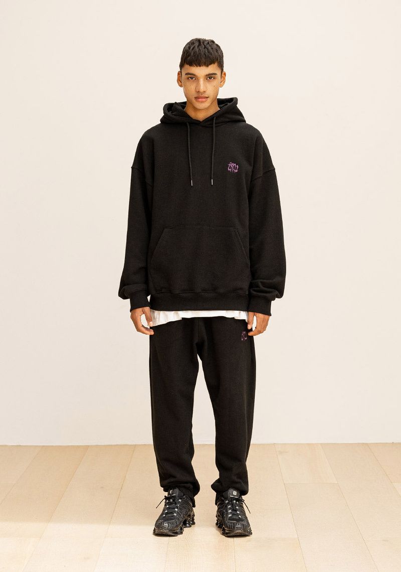 GRATING EMBLEM BACK SLIT ZIP PANTS