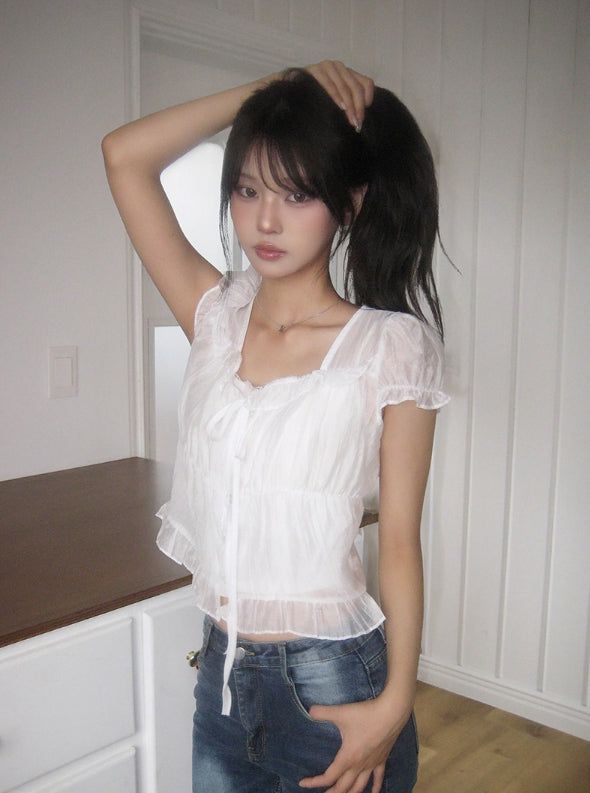 anyonemore（エニーワンモアー）の「Neron Shirring Frill Ribbon Puff See-through Short Sleeve Blouse（Tops）」