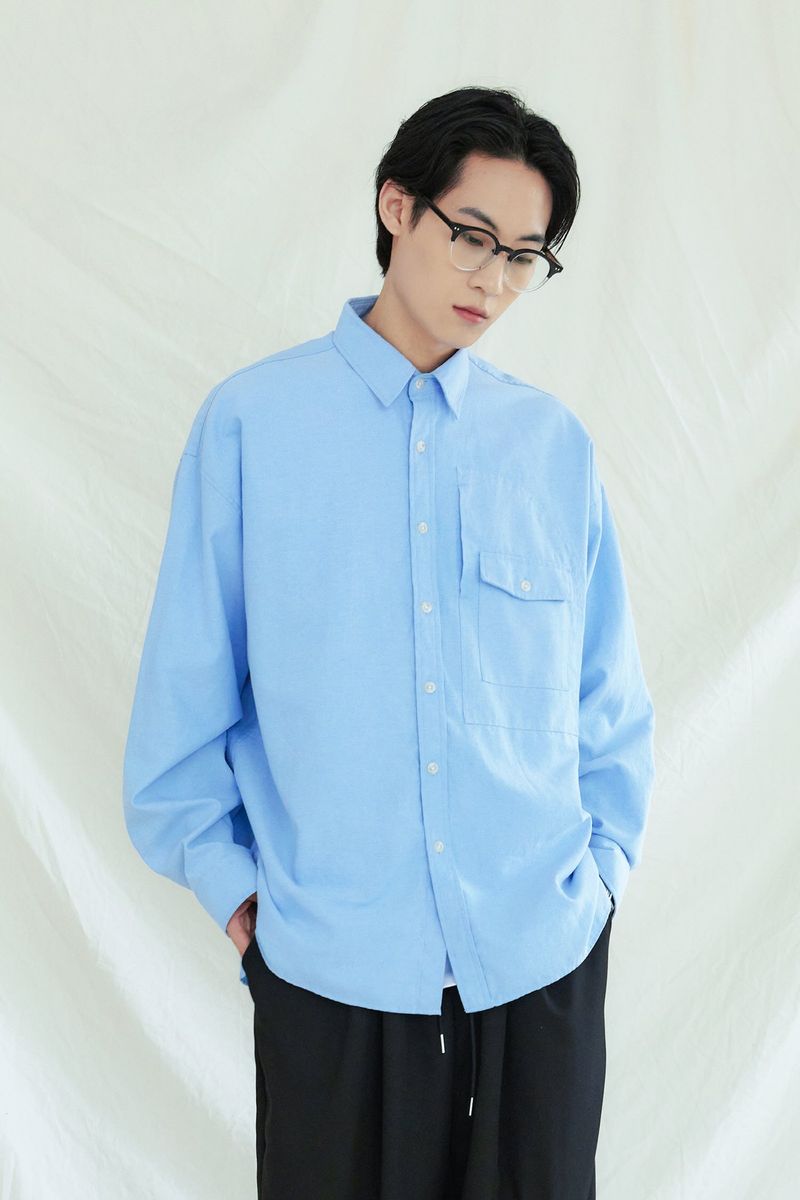 KND(ケイエンド)の「UTILITY CURVED POCKET OXFORD SHIRT SKYBLUE(Tops)」