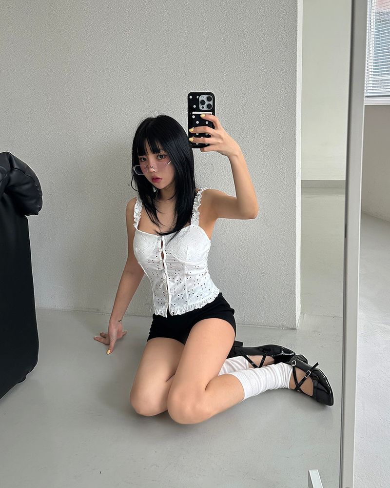 a punching eyelet bustier blouse
