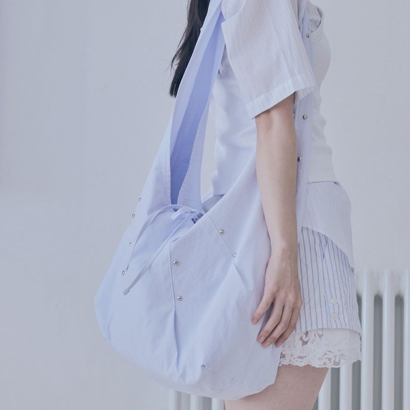 poie(ポイエ)の「rivet cross bag (sky blue)(Bags)」