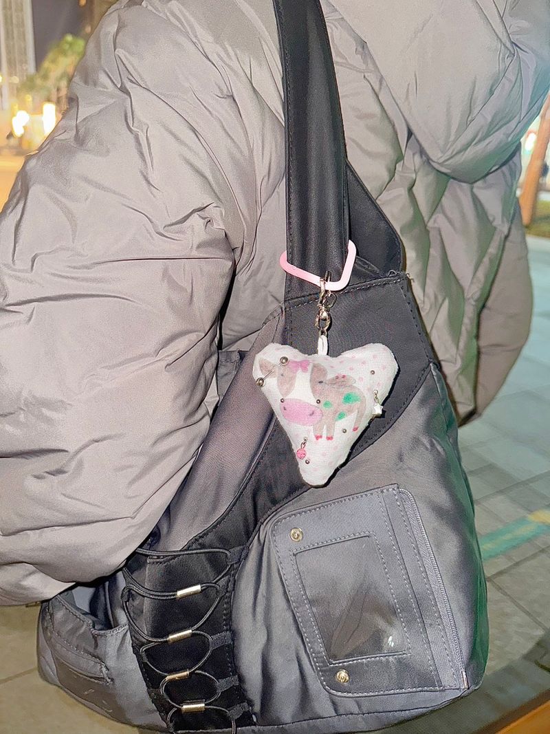 Pierced pinky cow keychain