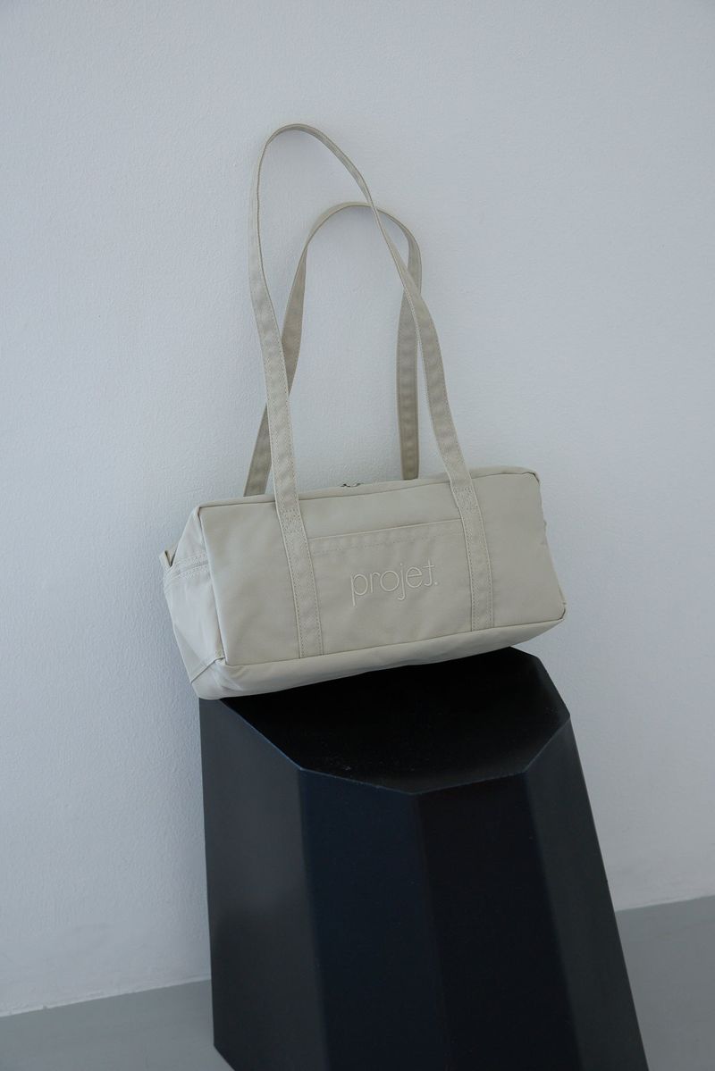 compact duffle bag (light beige)